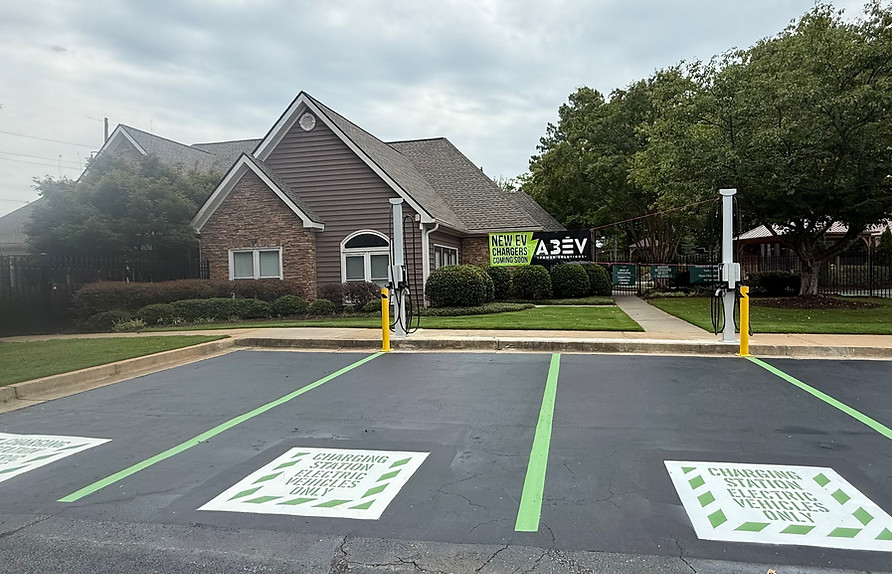 Freshly stenciled and striped EV parking spaces